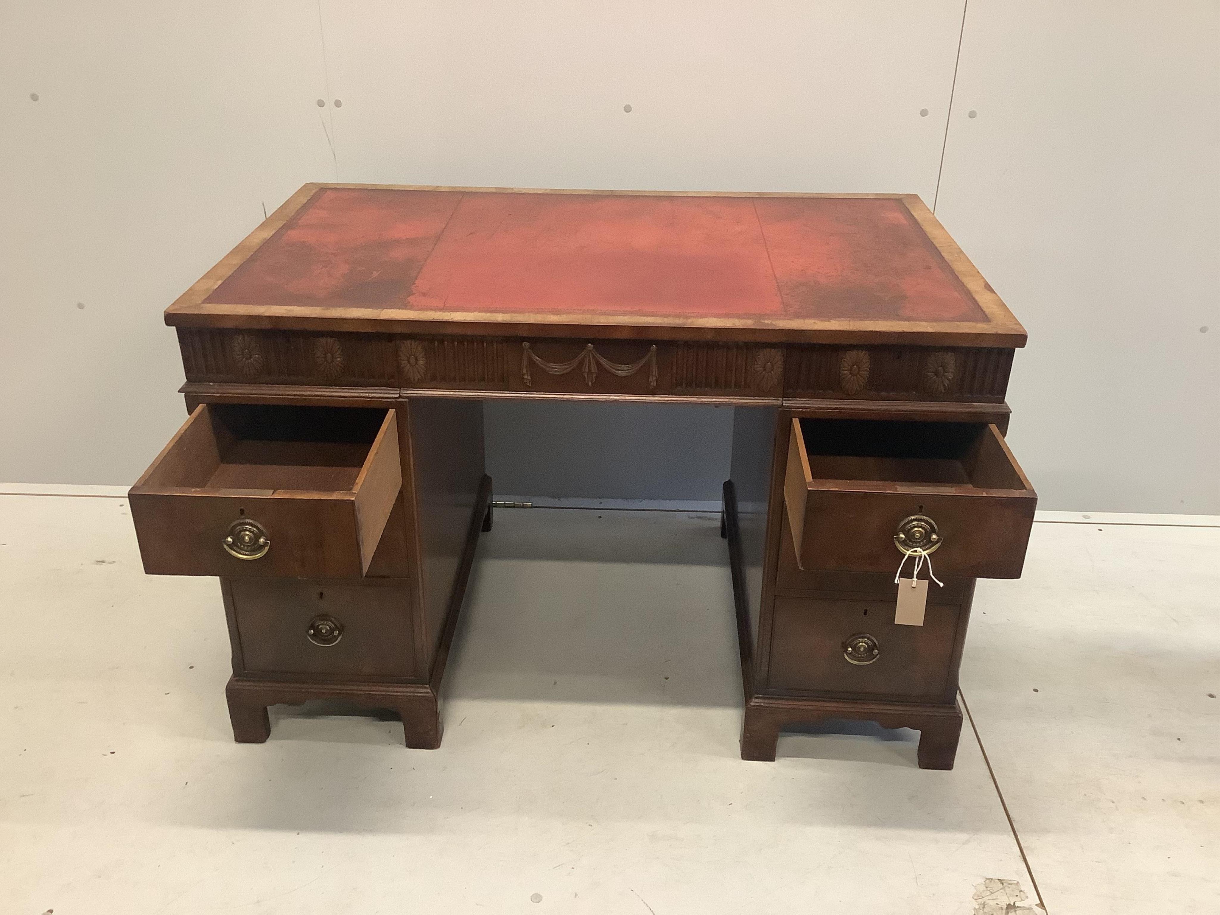 An early Georgian style walnut pedestal desk with inset leather top, width 117cm, depth 71cm, height 77cm. Condition - fair to good